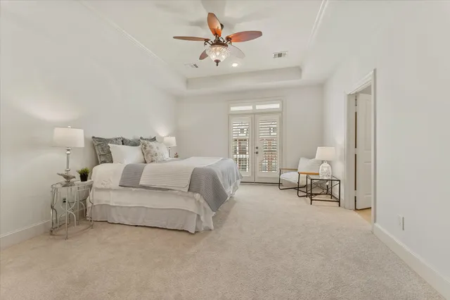 a bed room with a bed and a chair