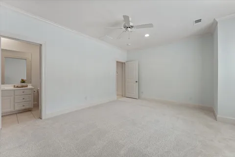 a view of an empty room with a bathroom