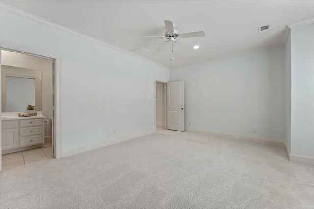 a view of an empty room with a bathroom