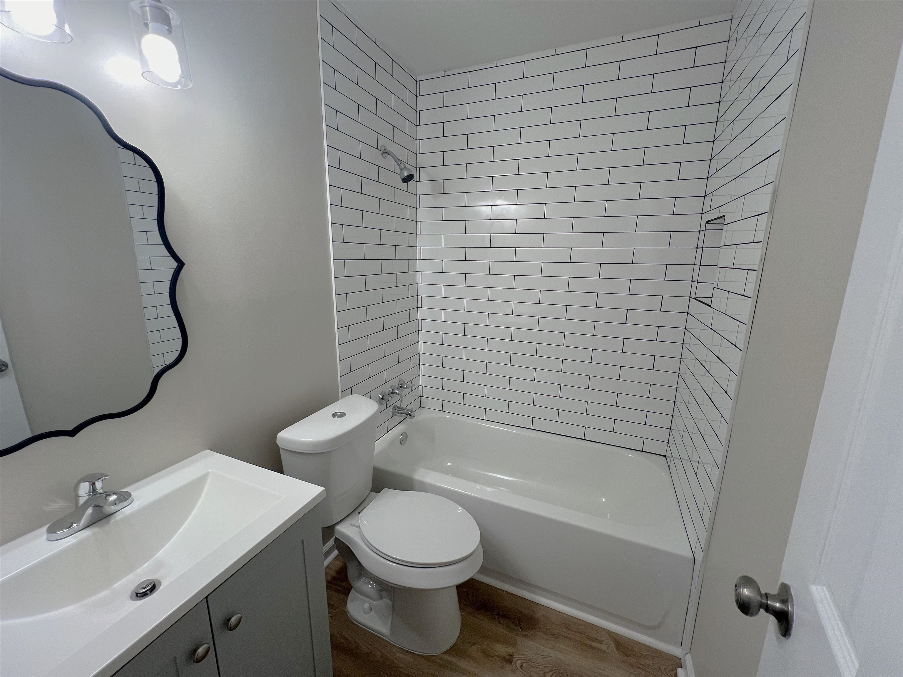 993 Poplar Leaf Road Collierville, TN 38017 - Photo 9 of 20 a bathroom with a bathtub shower sink vanity and toilet