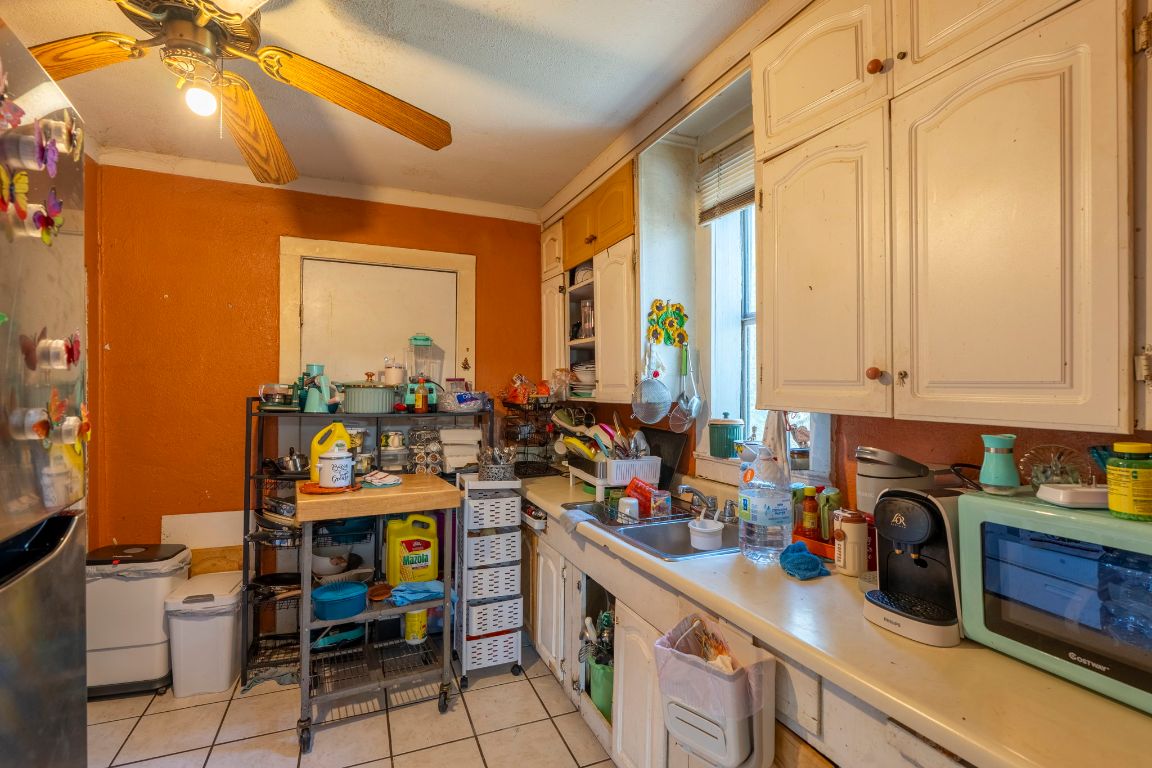 4801 Lott Avenue Austin, TX 78721 - Photo 4 of 20 a kitchen with a stove a sink and a refrigerator