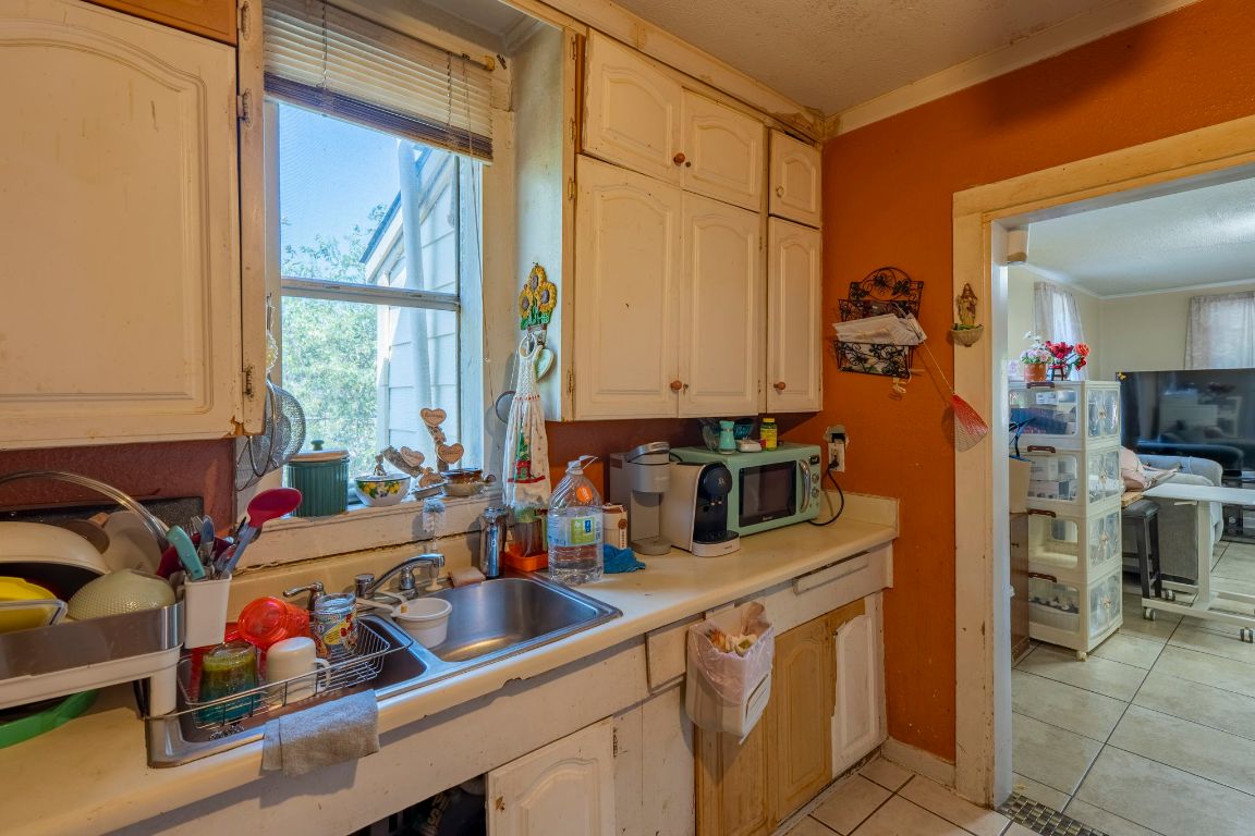 4801 Lott Avenue Austin, TX 78721 - Photo 6 of 20 a kitchen with lots of counter top space and a window