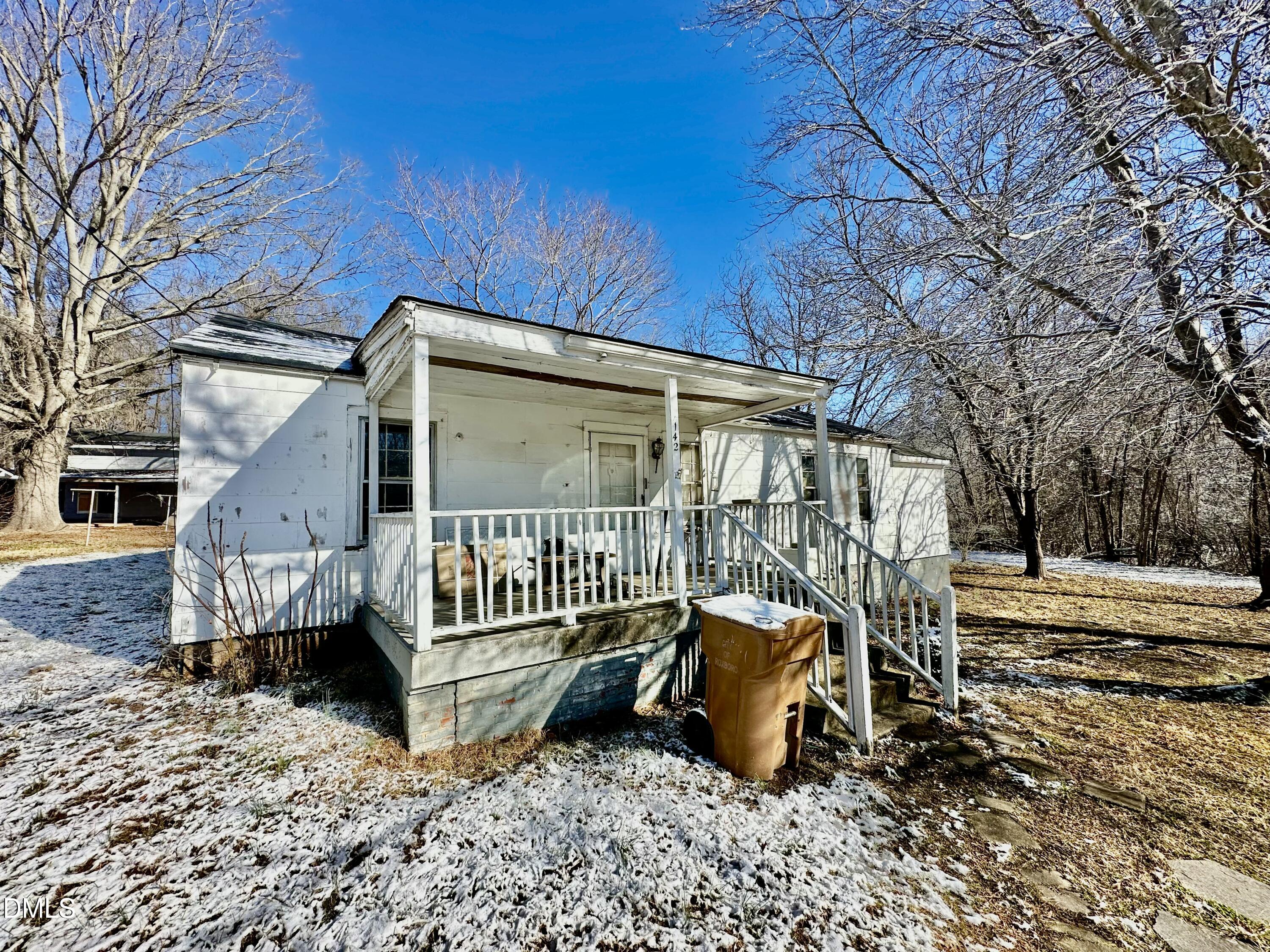142 Yarborough Street Roxboro, NC 27573 - Photo 2 of 12 a view of a chair in the backyard