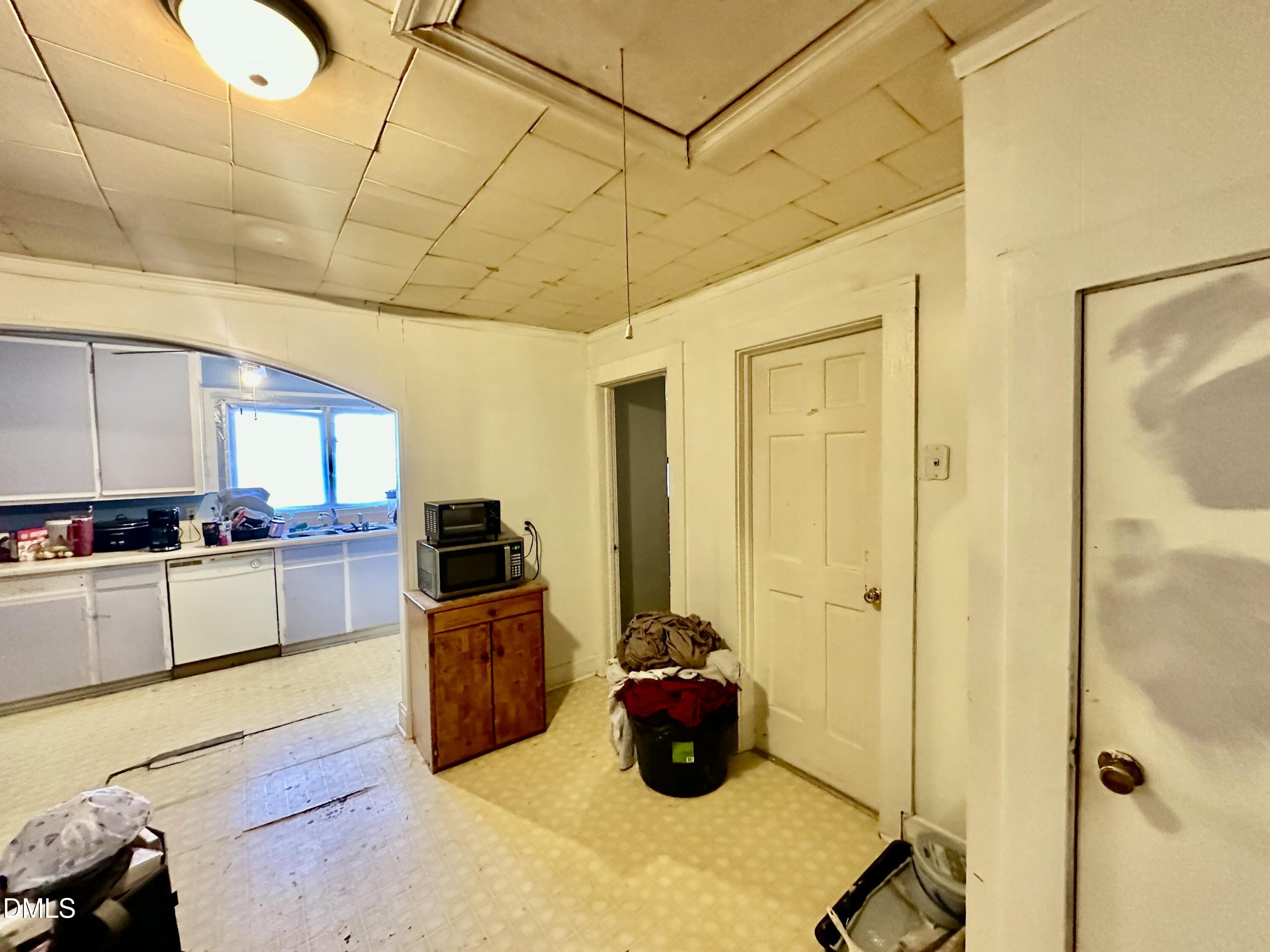 142 Yarborough Street Roxboro, NC 27573 - Photo 5 of 12 a kitchen with cabinets and appliances