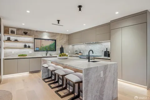 a kitchen with a stove and a sink