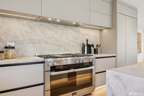 a bathroom with a toilet and a mirror