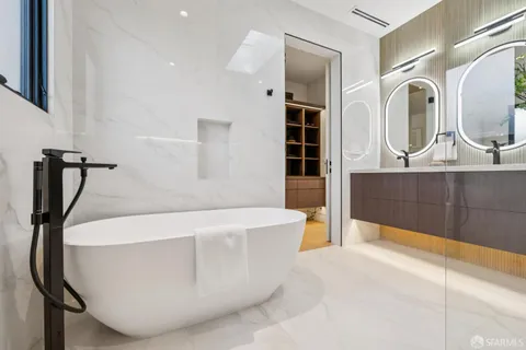 a view of a dinning table and chairs in patio of the house