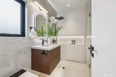 a view of a patio with table and chairs with wooden floor and plants