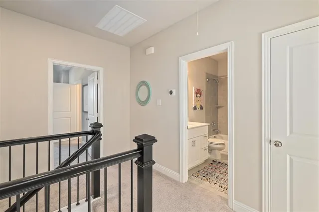 a view of a bathroom from the hallway