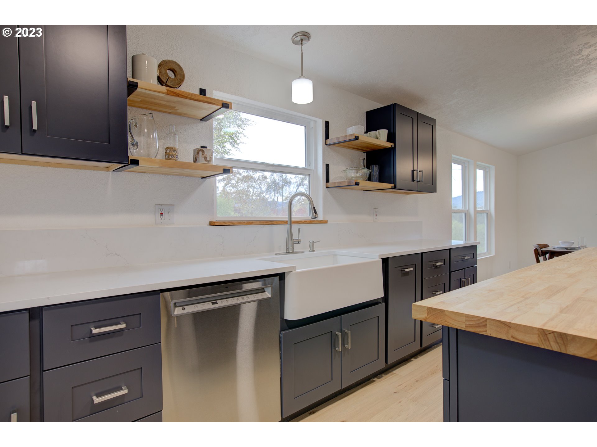 800 Glenbrook Loop Road Riddle, OR 97469 - Photo 16 of 44 a kitchen with a sink cabinets and wooden floor