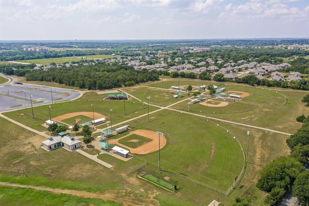 3344 Duncan Way Corinth, TX 76210 - Photo 31 of 38 Aerial depiction of a large sports complex featuring multiple baseball fields, surrounding green spaces, and a parking area