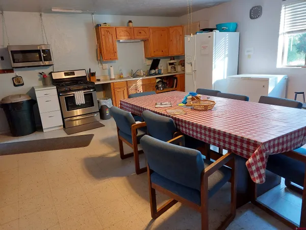 a view of a dining room with furniture