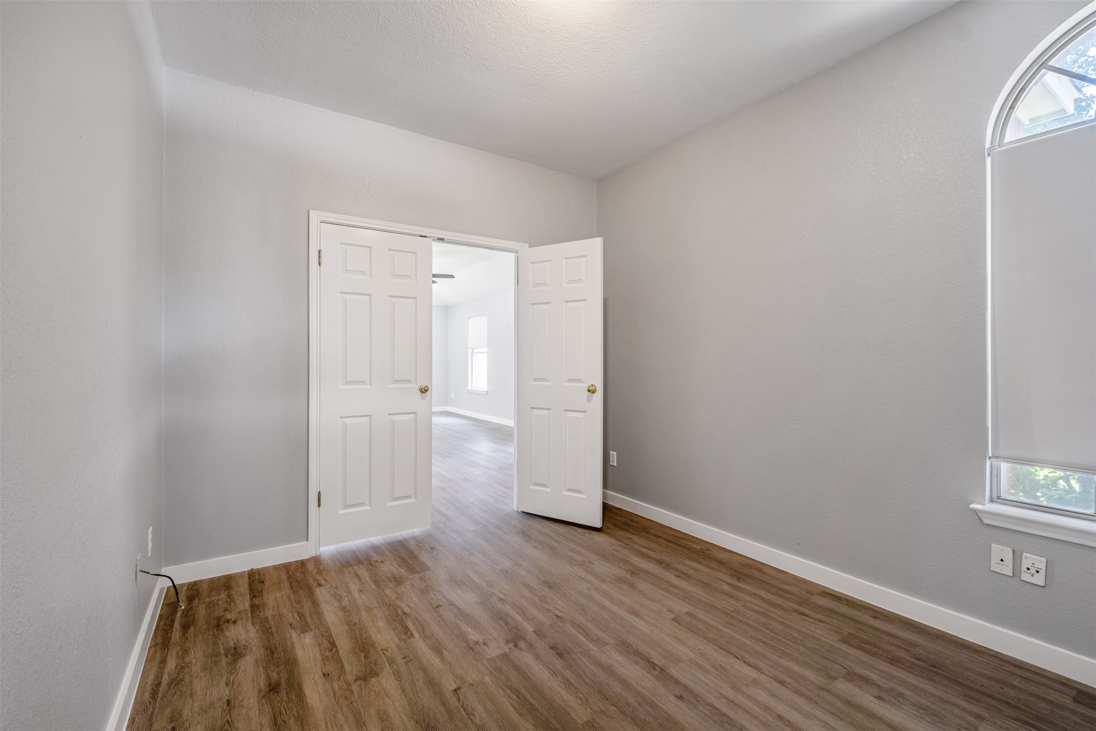 3413 Ruby Red Drive Austin, TX 78728 - Photo 19 of 19 Bright, versatile room with elegant wood flooring and arched window.