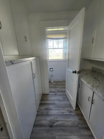 a view of a storage and utility room in a house