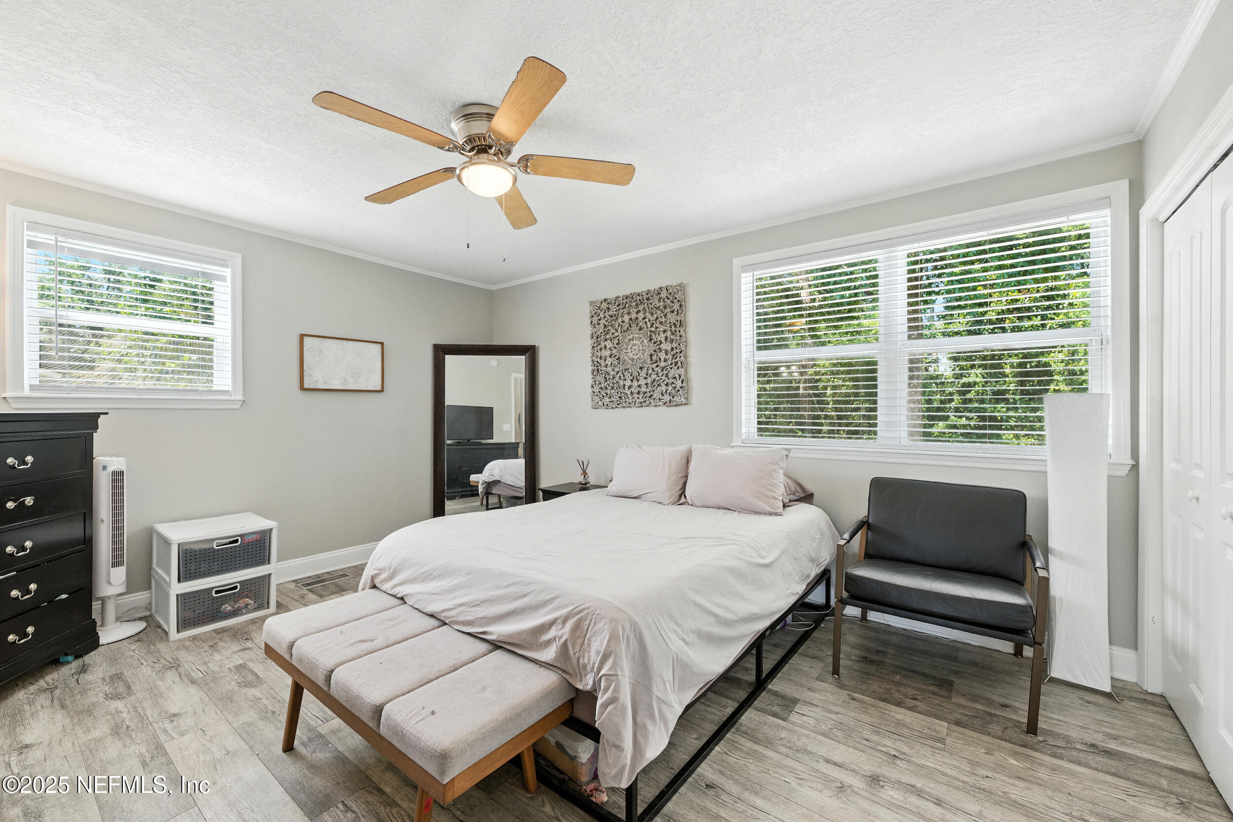 706 Estates Cove Road Jacksonville, FL 32221 - Photo 12 of 26 a bedroom with a bed and a desk