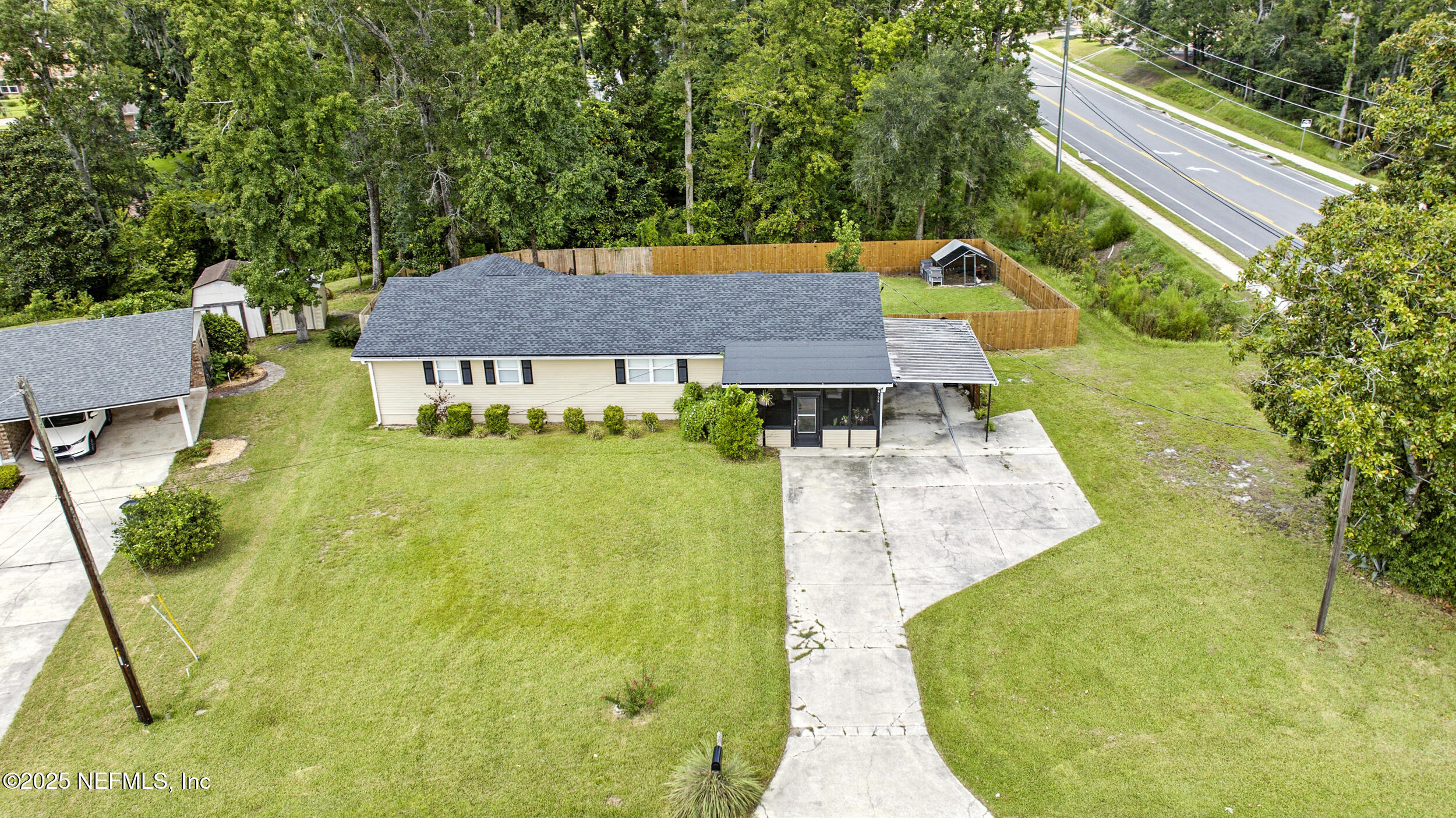 706 Estates Cove Road Jacksonville, FL 32221 - Photo 2 of 26 a aerial view of a house with swimming pool and large trees