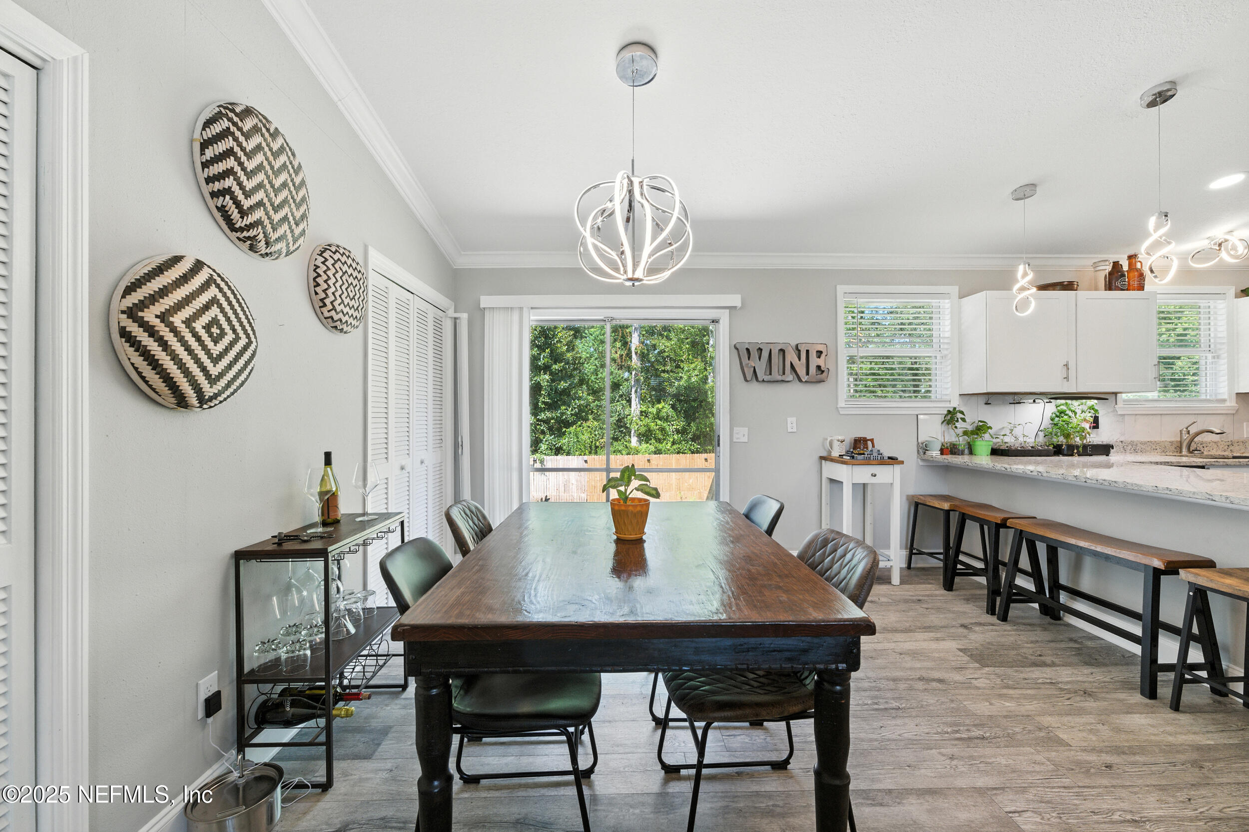 706 Estates Cove Road Jacksonville, FL 32221 - Photo 9 of 26 a view of a dining room with furniture window and outside view