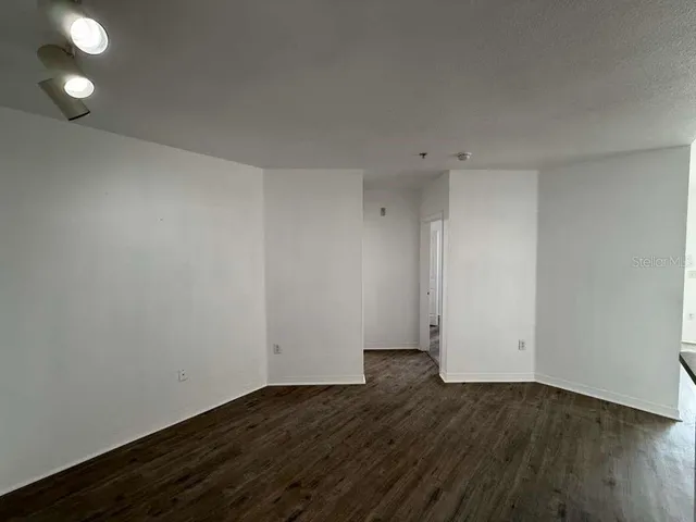 a view of room with wooden floor