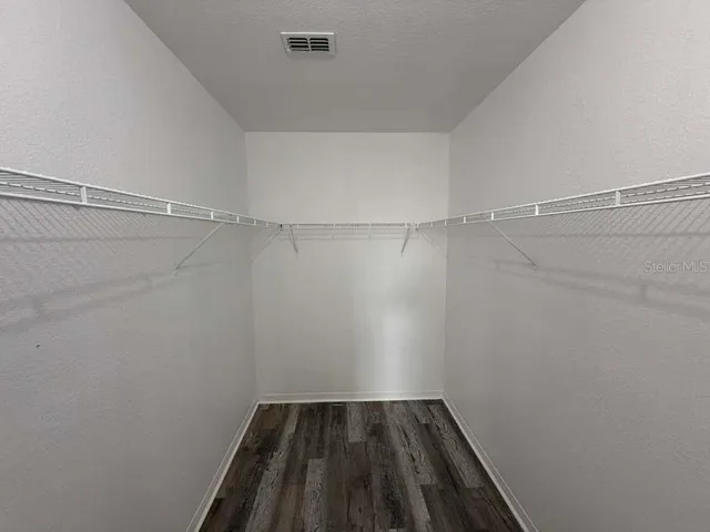 a view of a room with racks on the wall