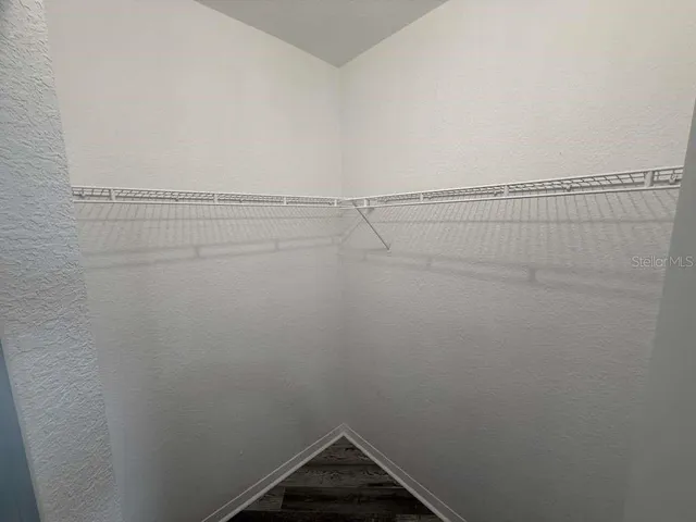 a view of a room with racks on the wall