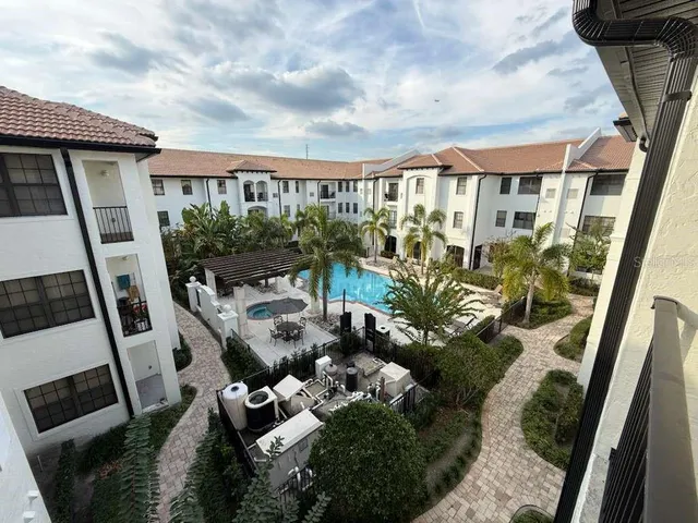 a front view of a house with outdoor seating