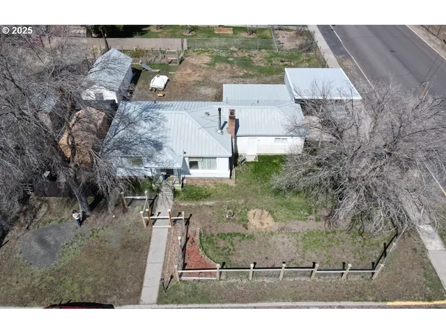 an aerial view of residential house with outdoor space