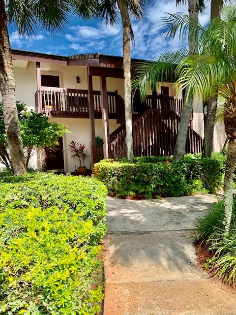 9256 Sable Ridge Circle, Unit B Boca Raton, FL 33428 - Photo 1 of 21 a front view of a house with a yard