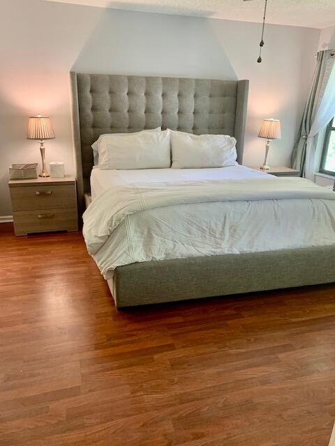 9256 Sable Ridge Circle, Unit B Boca Raton, FL 33428 - Photo 11 of 21 a bedroom with a bed and a night stand