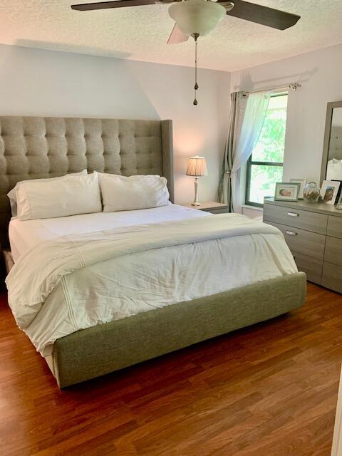 9256 Sable Ridge Circle, Unit B Boca Raton, FL 33428 - Photo 10 of 21 a large bed sitting in a bedroom next to a window