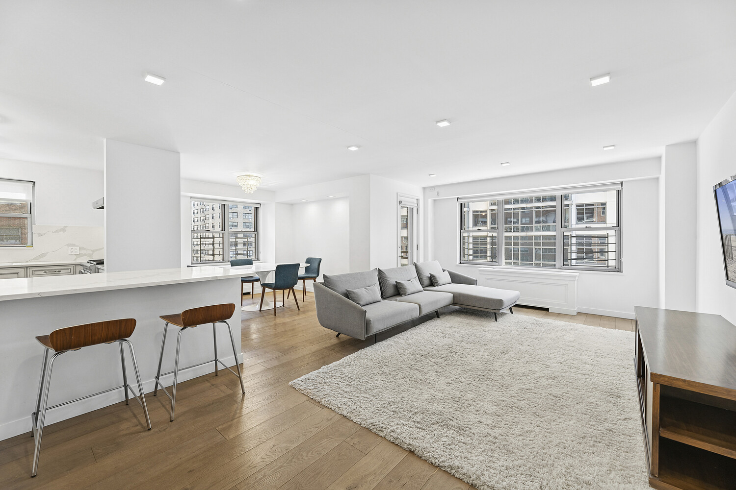 360 East 72nd Street, Unit B610 Manhattan, NY 10021 - Photo 1 of 11 a living room with furniture and a window