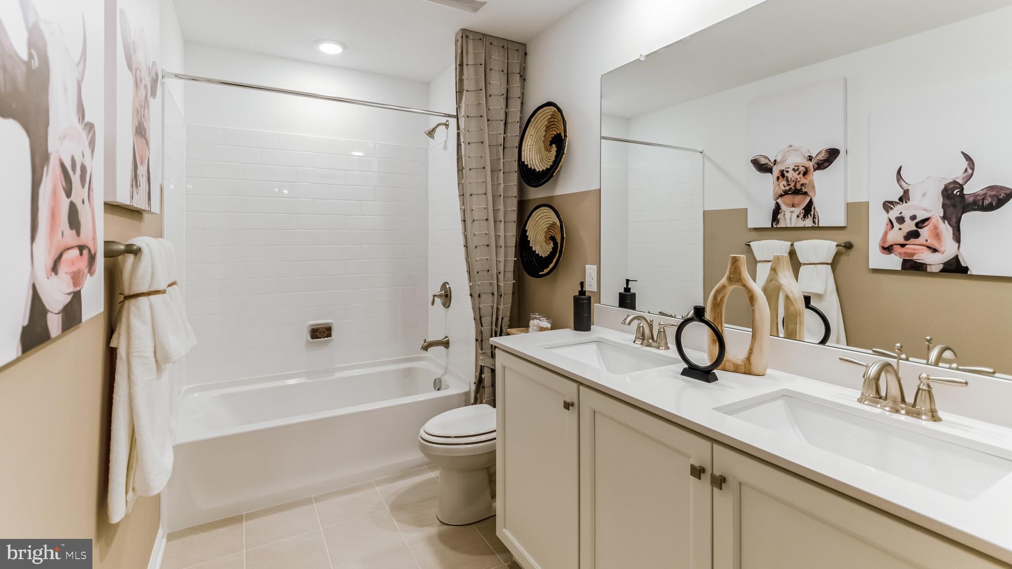 424 Church Road Eagleville, PA 19403 - Photo 21 of 31 a bathroom with a sink a toilet and a bathtub