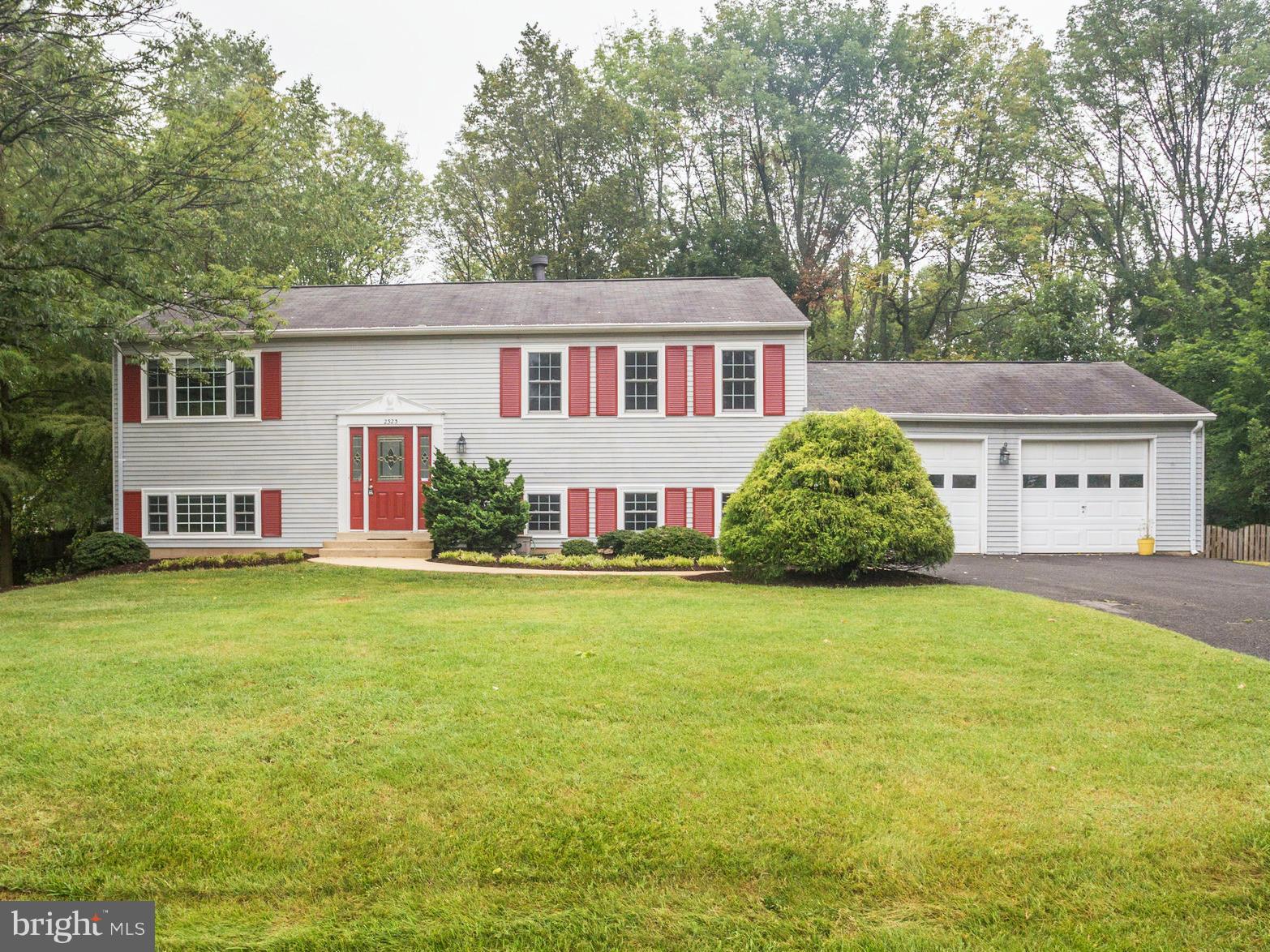 2323 Archdale Road Reston, VA 20191 - Photo 1 of 30 a front view of a house with garden