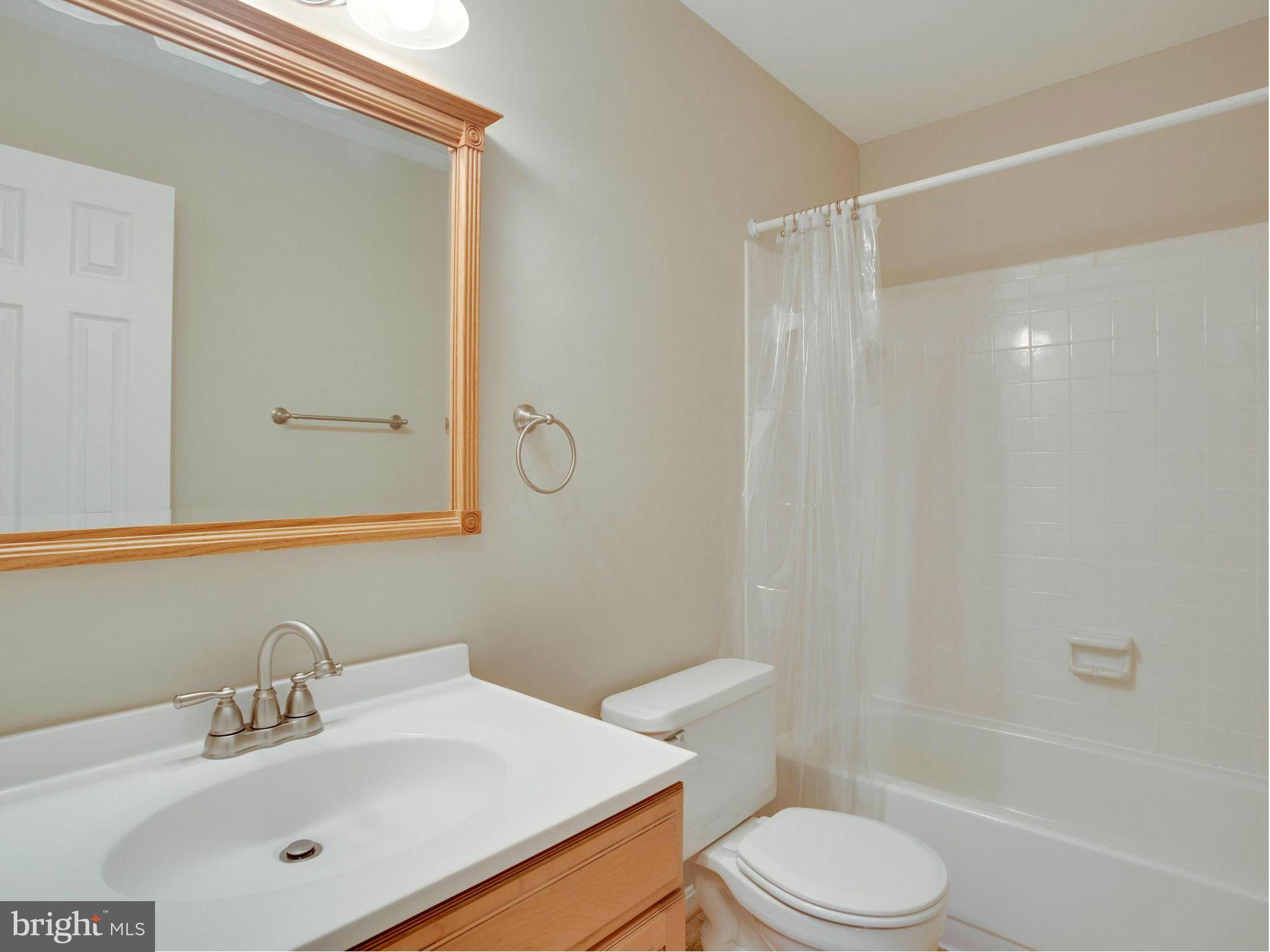 2323 Archdale Road Reston, VA 20191 - Photo 17 of 30 a bathroom with a sink toilet and shower