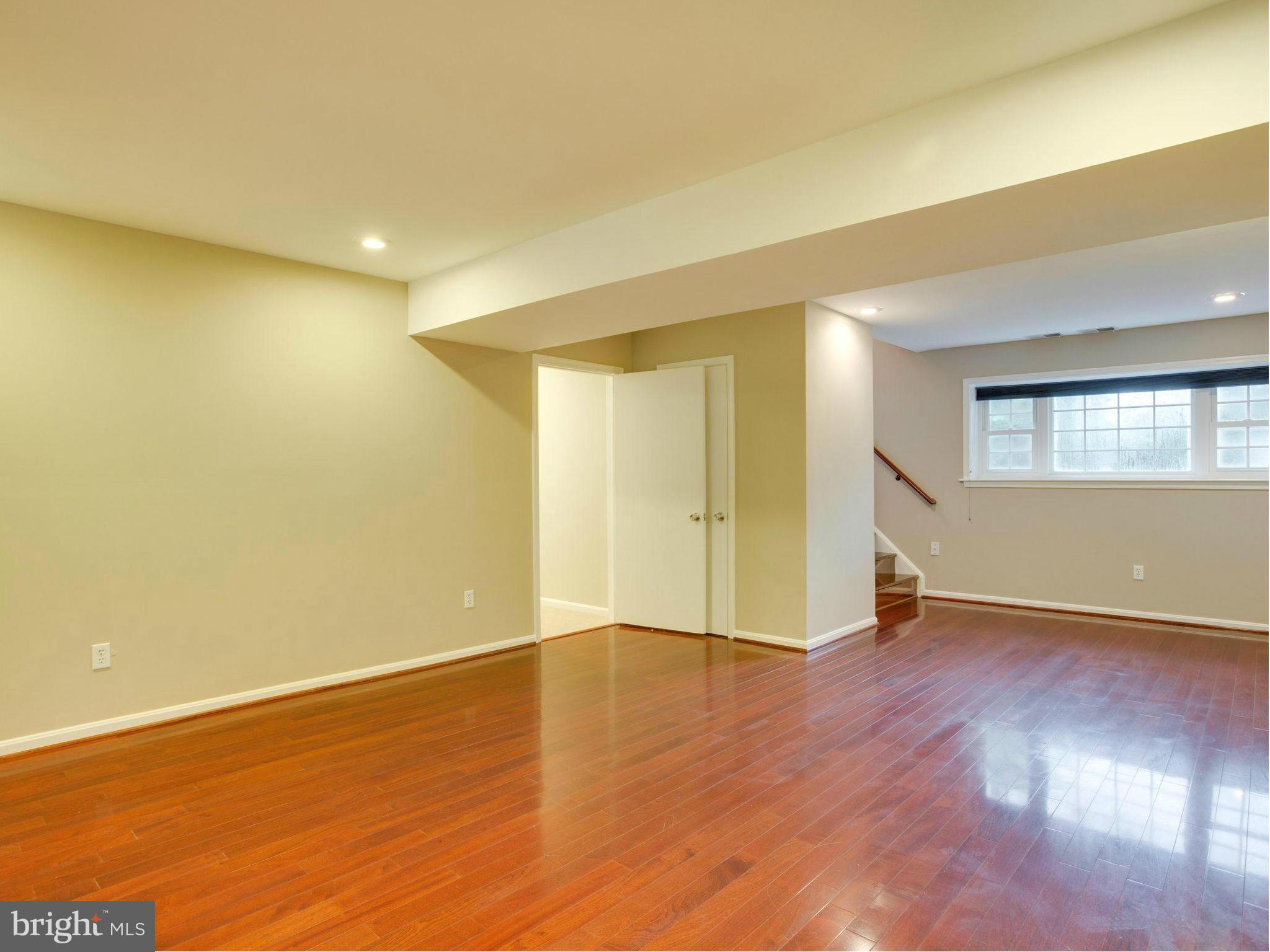 2323 Archdale Road Reston, VA 20191 - Photo 19 of 30 an empty room with wooden floor and windows