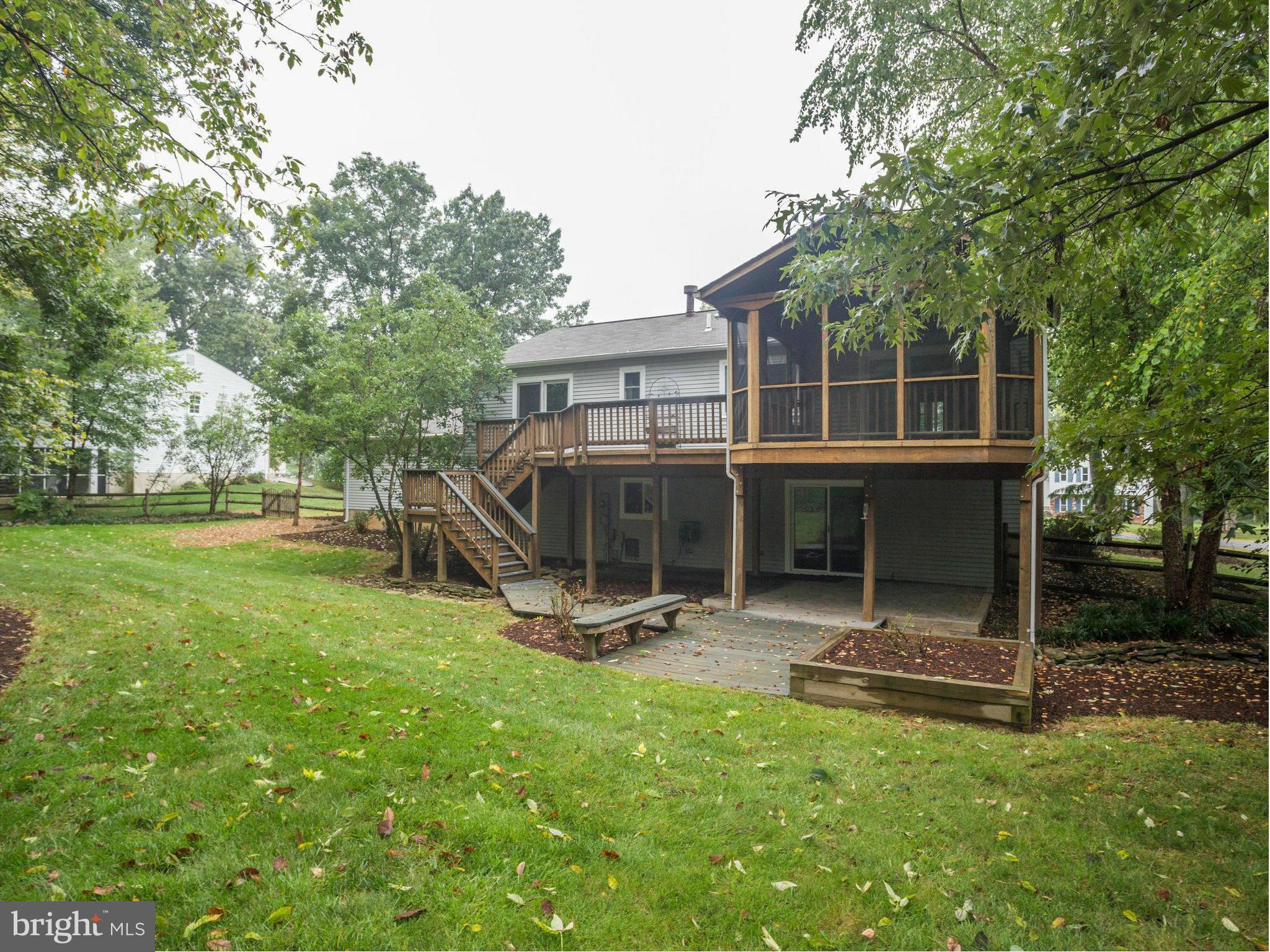 2323 Archdale Road Reston, VA 20191 - Photo 26 of 30 a view of a house with backyard and a tree