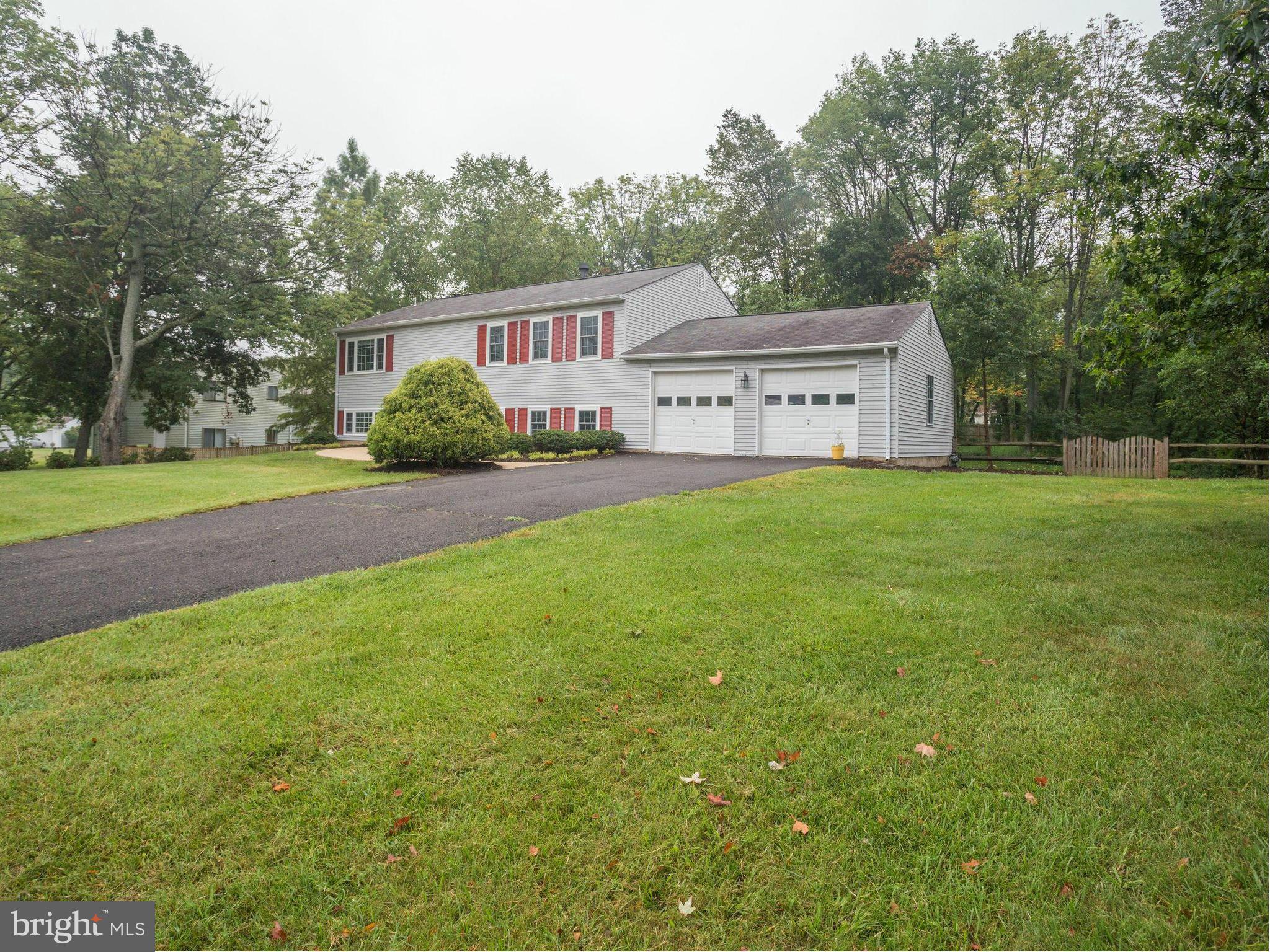 2323 Archdale Road Reston, VA 20191 - Photo 29 of 30 a view of a house with a yard and a large tree