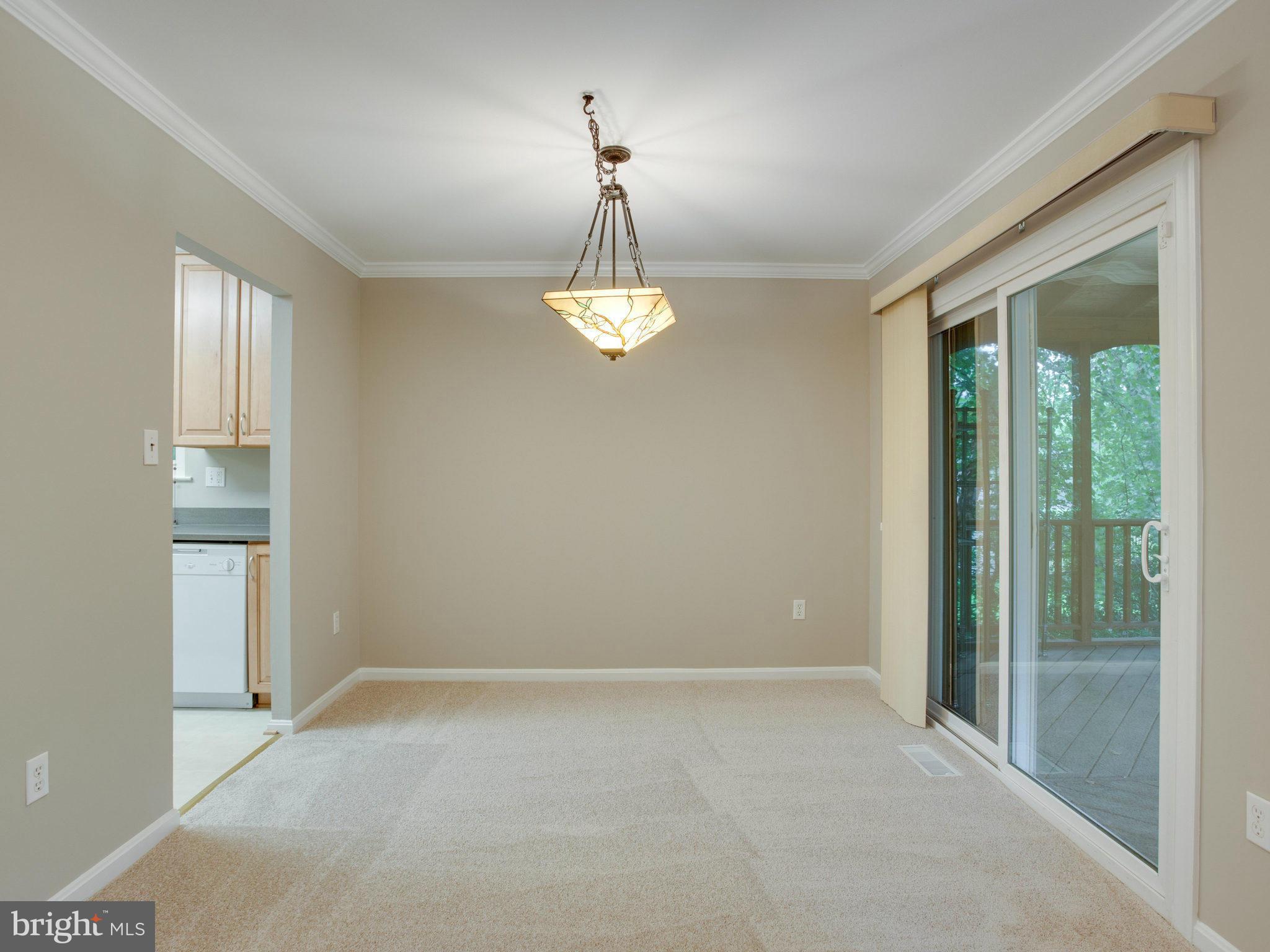 2323 Archdale Road Reston, VA 20191 - Photo 9 of 30 a view of a chandelier in big room and windows