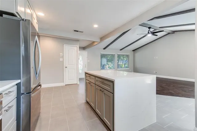 a view of a kitchen with a sink and cabinets
