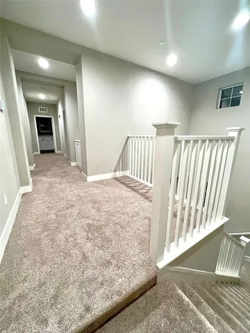 a view of a hallway view with staircase