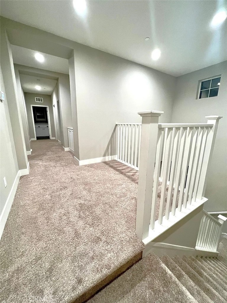 5177 Pomona Rincon Road Eastvale, CA 92880 - Photo 11 of 25 a view of a hallway view with staircase