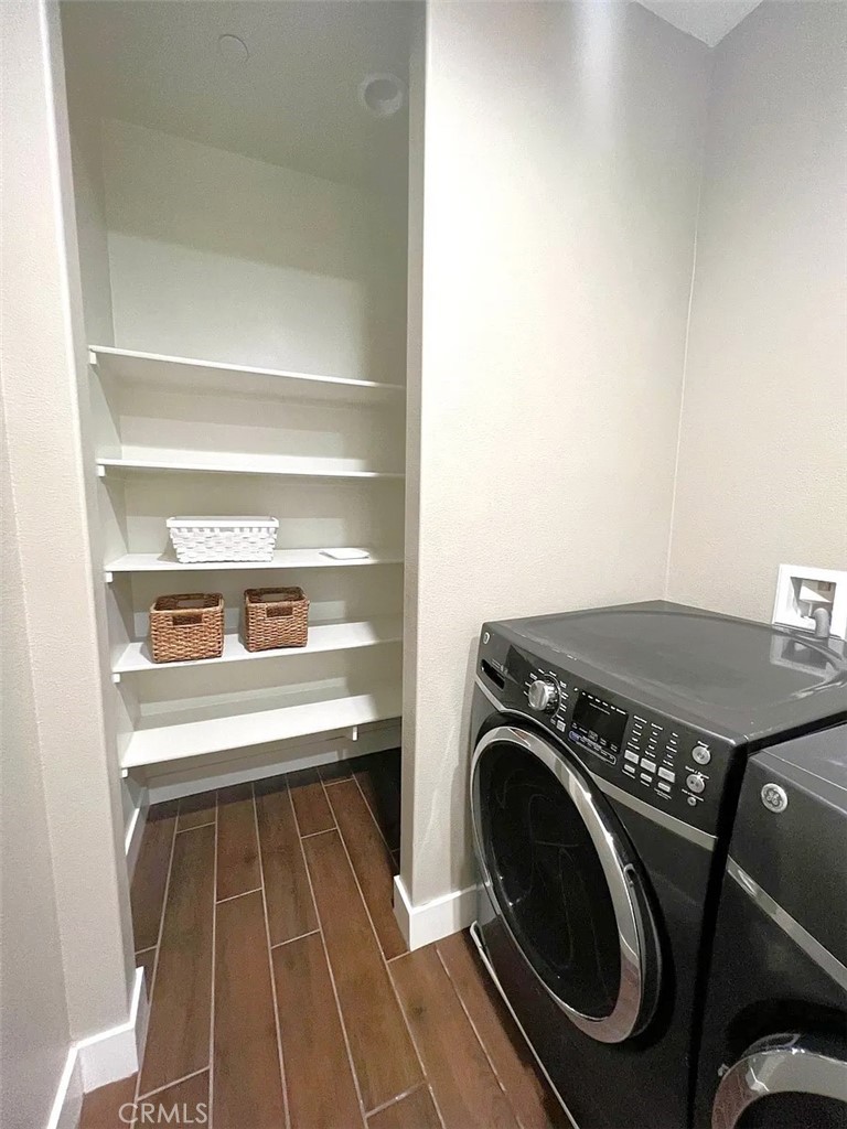 5177 Pomona Rincon Road Eastvale, CA 92880 - Photo 14 of 25 a utility room with washing machine