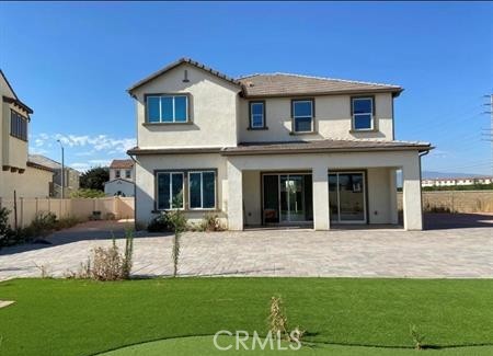5177 Pomona Rincon Road Eastvale, CA 92880 - Photo 25 of 25 a front view of a house with a yard