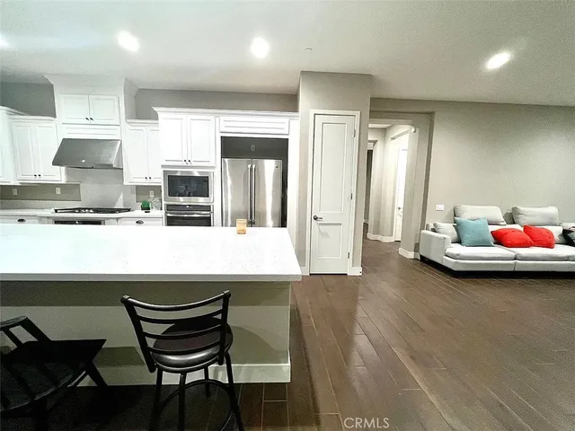 a kitchen with a table and chairs in it