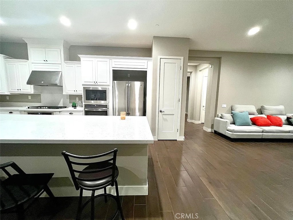 5177 Pomona Rincon Road Eastvale, CA 92880 - Photo 9 of 25 a kitchen with a table and chairs in it