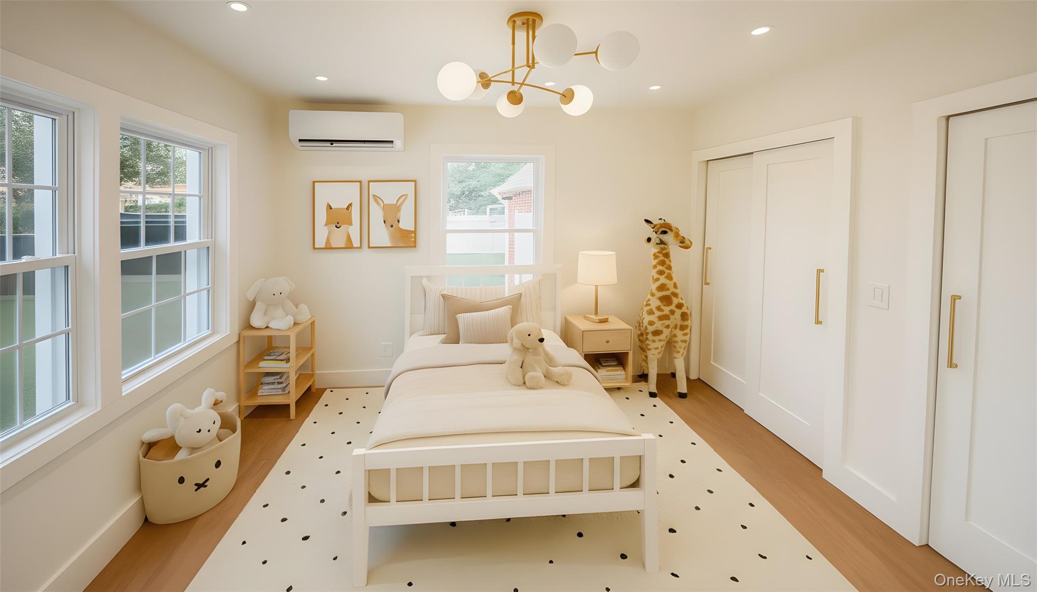 504 Gazzola Drive, Unit A East Patchogue, NY 11772 - Photo 11 of 13 a bedroom with a bed and a window