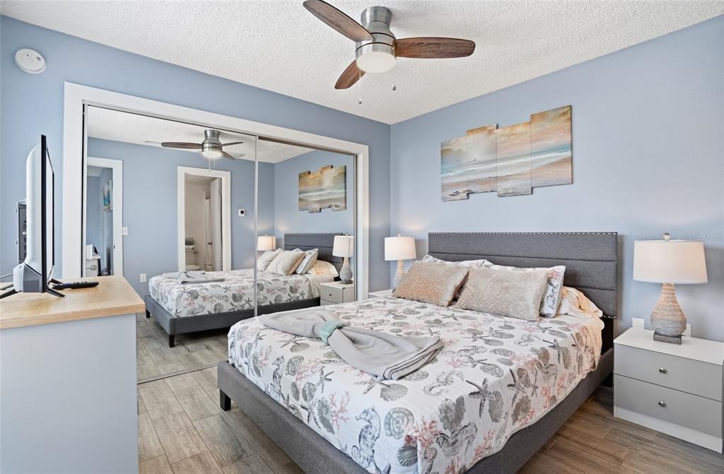 155 Medallion Boulevard, Unit E Madeira Beach, FL 33708 - Photo 17 of 33 a bedroom with double bed and a dresser