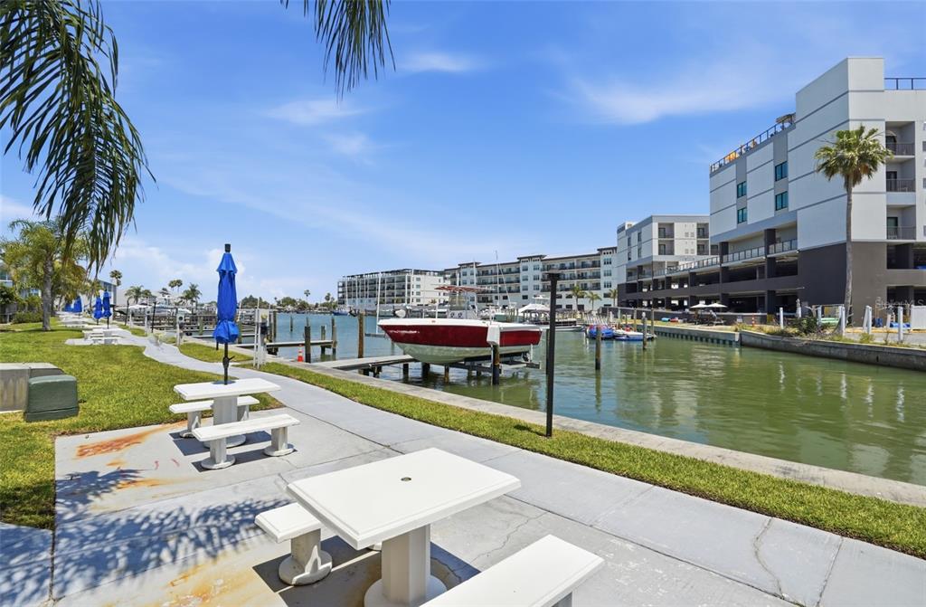 155 Medallion Boulevard, Unit E Madeira Beach, FL 33708 - Photo 22 of 33 a view of a lake with a city