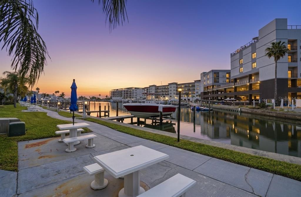 155 Medallion Boulevard, Unit E Madeira Beach, FL 33708 - Photo 23 of 33 a city view with a lake view