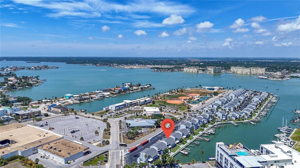 155 Medallion Boulevard, Unit E Madeira Beach, FL 33708 - Photo 29 of 33 a view of a city and an ocean view