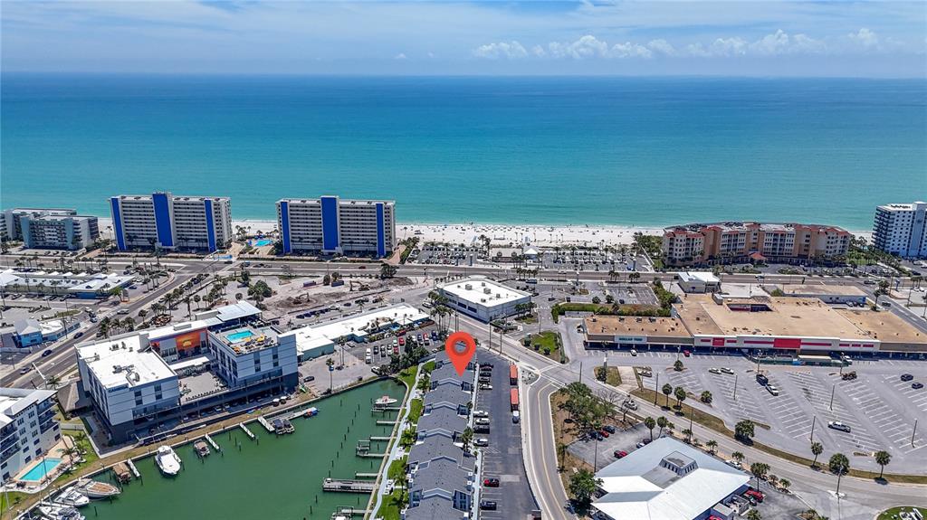 155 Medallion Boulevard, Unit E Madeira Beach, FL 33708 - Photo 30 of 33 a city view with tall buildings